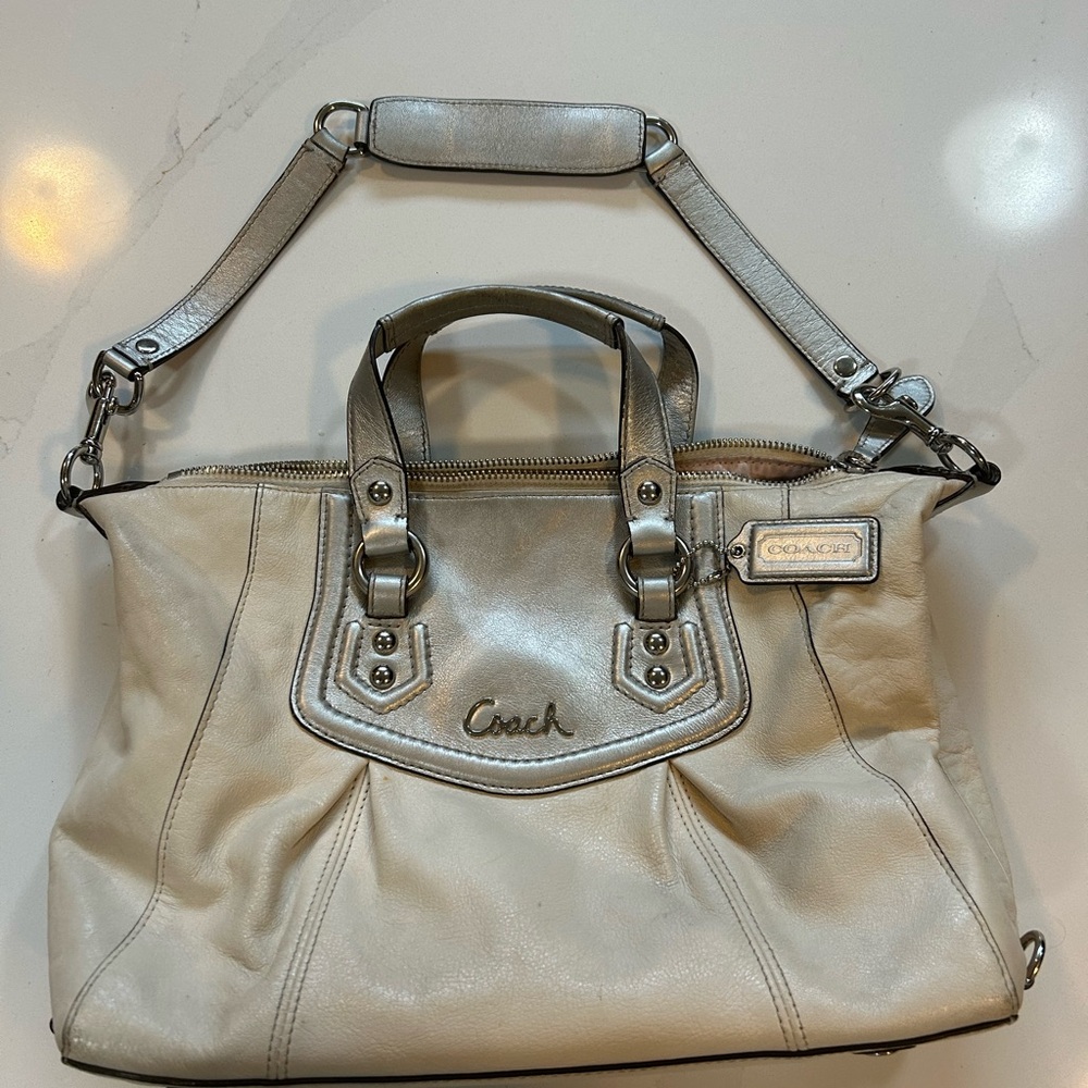 Coach white with silver accents leather handbag.